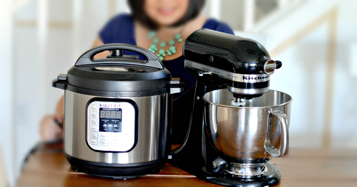 a pressure cooker and a kitchenaid mixer side by side