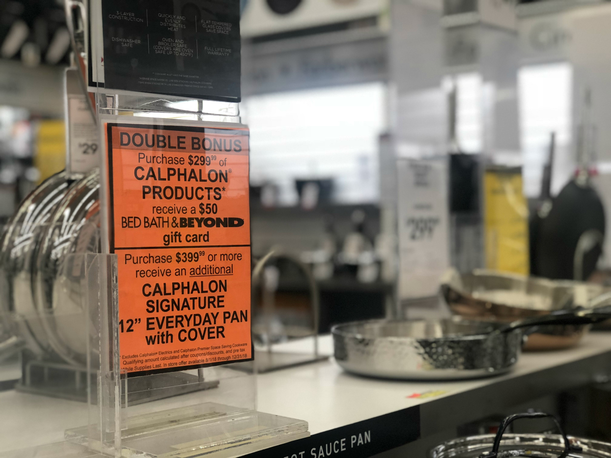 Bed Bath & Beyond gift card offer sign next to cookware
