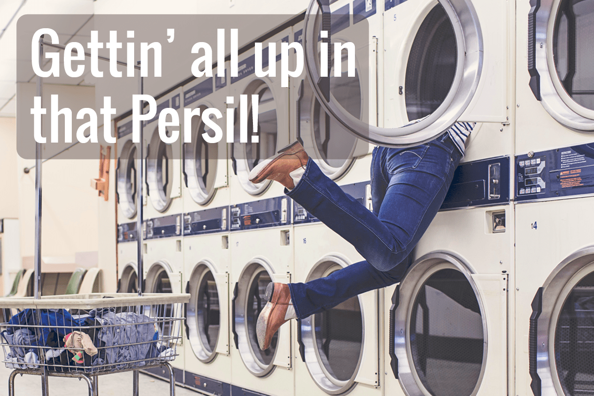 woman hanging out of a washing machine in a laundromat with "Gettin' all up in that Persil!"