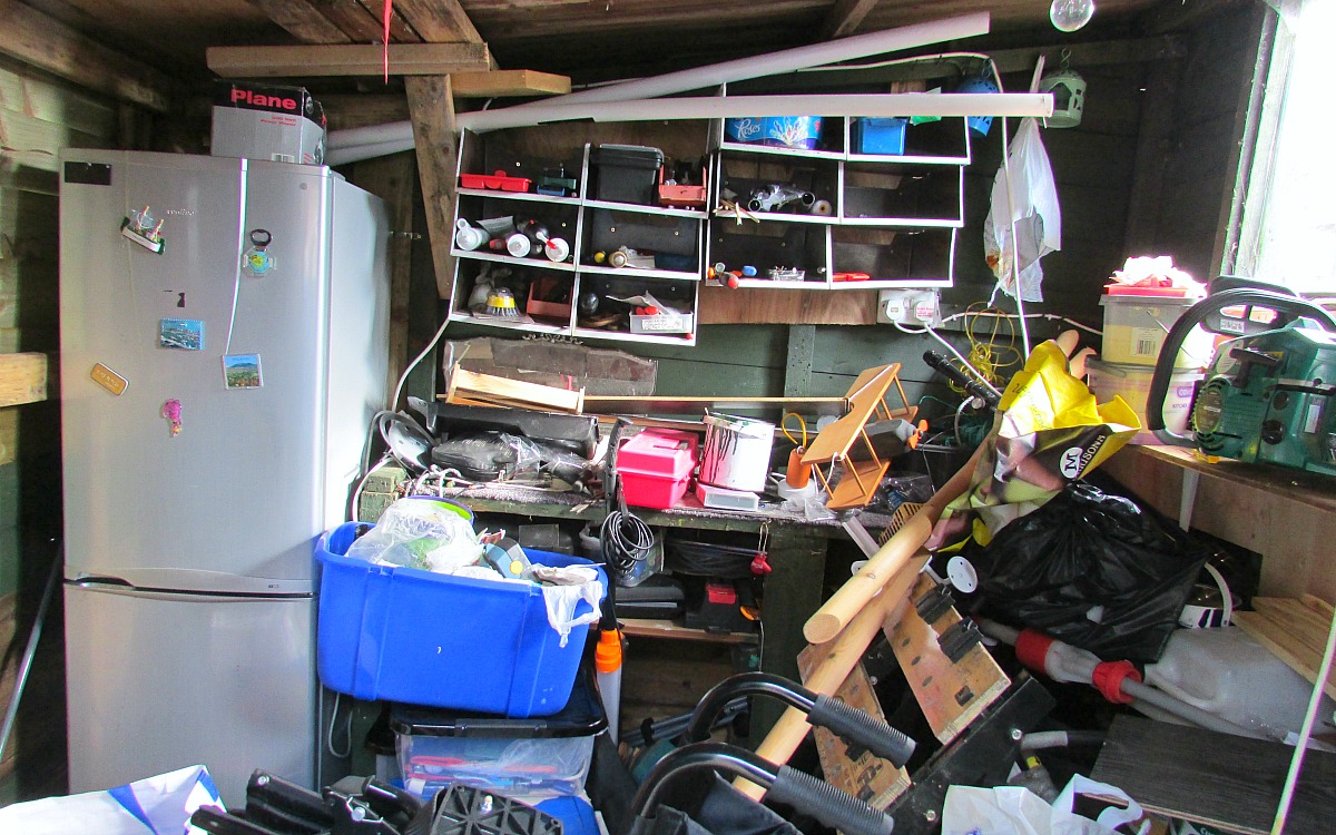 decluttering and organizing with simple home tips — messy garage full of clutter