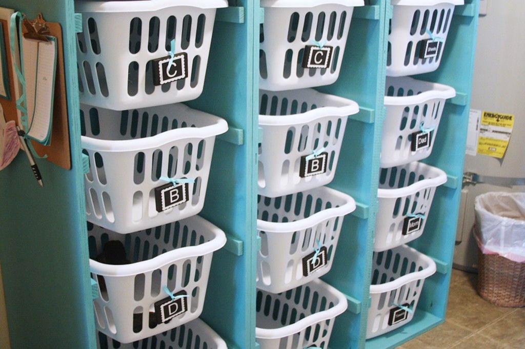 hanging laundry baskets with labels for organization