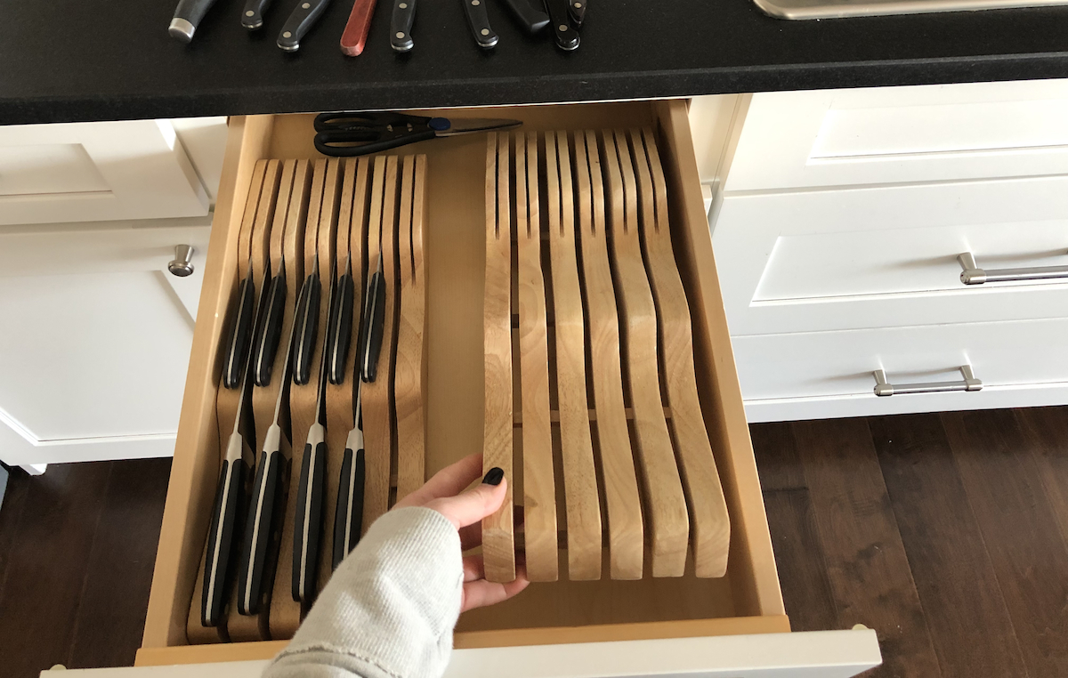 adding knife organizers to the drawer, one at a time