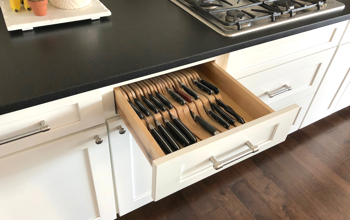 side view of the open drawer with knife organizers