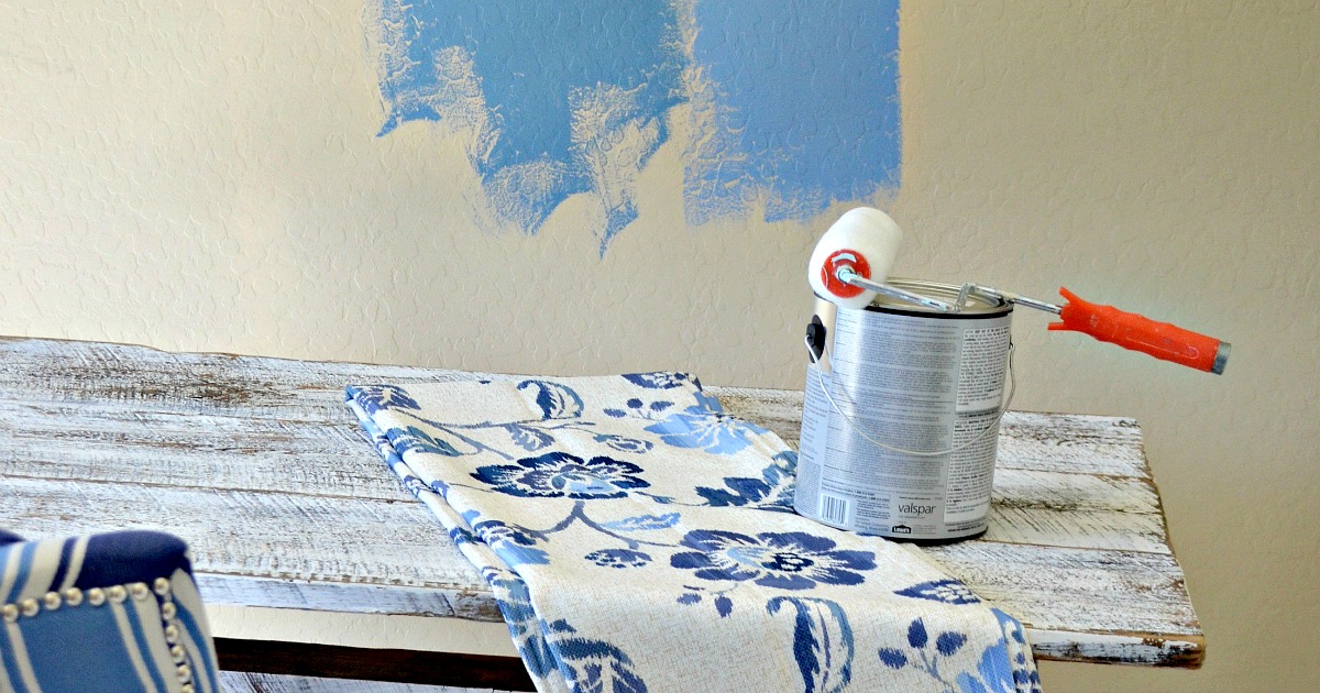 paint can and roller on a table