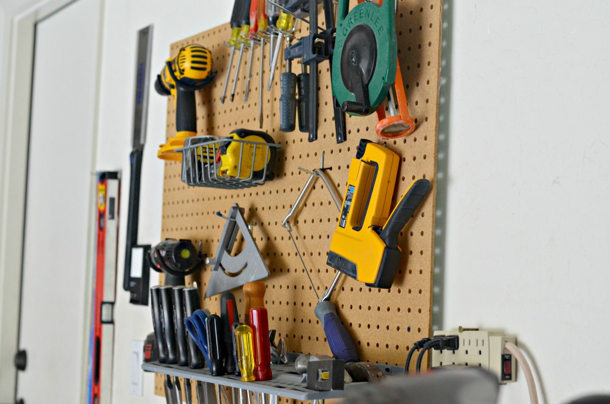 tools on a pegboard wall