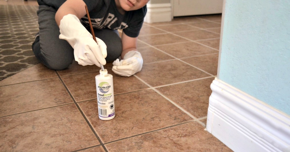 applying grout renewer to a tile floor