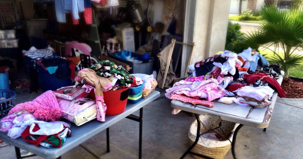 yard sale tables covered in clothing