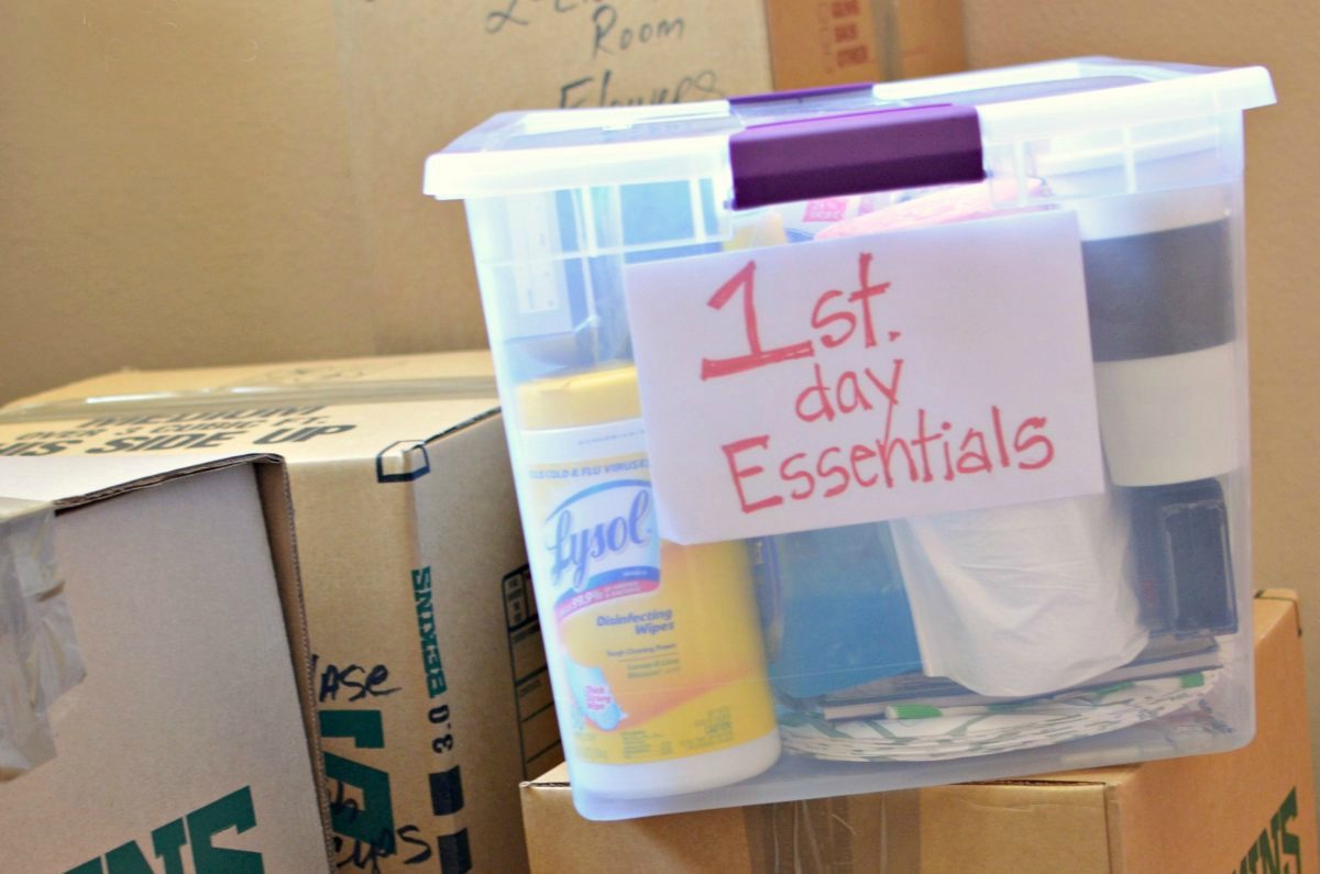 a clear box labeled 1st day essentials