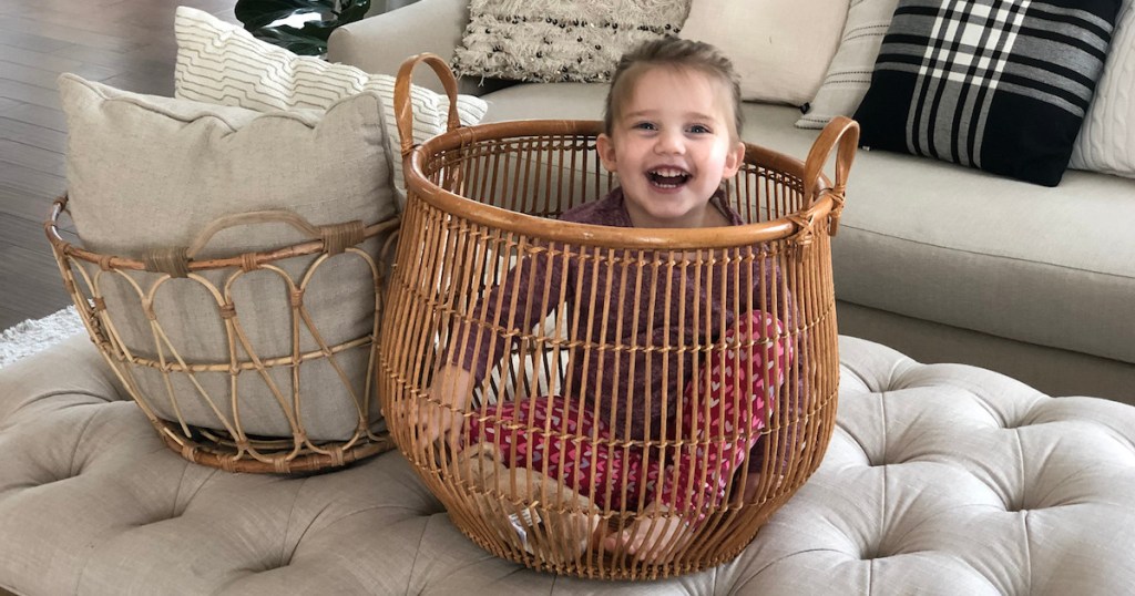 charli sitting inside of a basket laughing