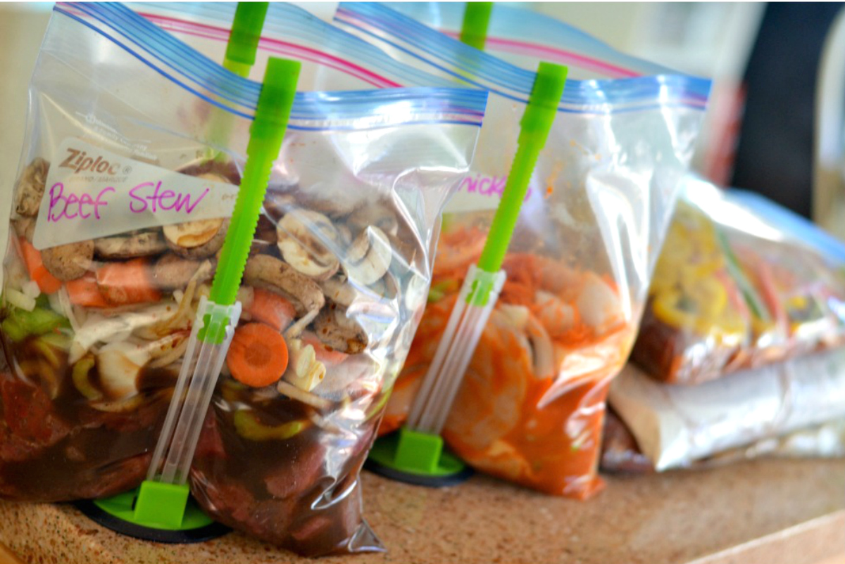 upright baggy holders with food portions inside
