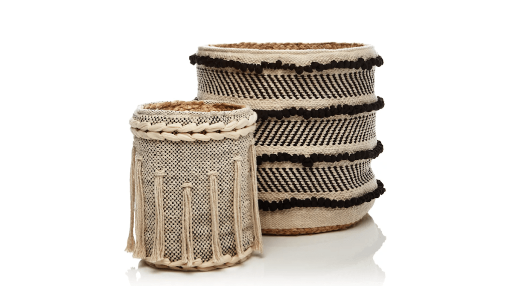 black and white ivory tassel fringe cotton baskets sitting next to each other