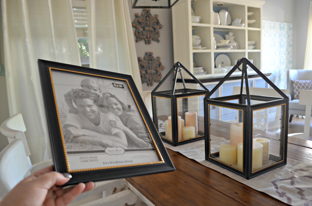 picture frame next to a lantern