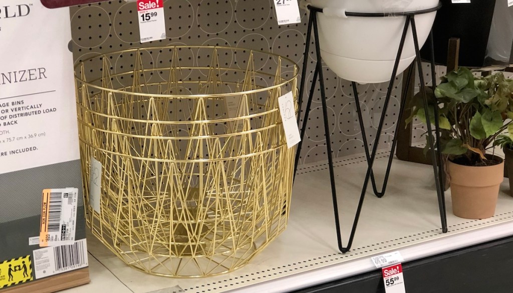 gold wire metal baskets stacked in a pile on shelf