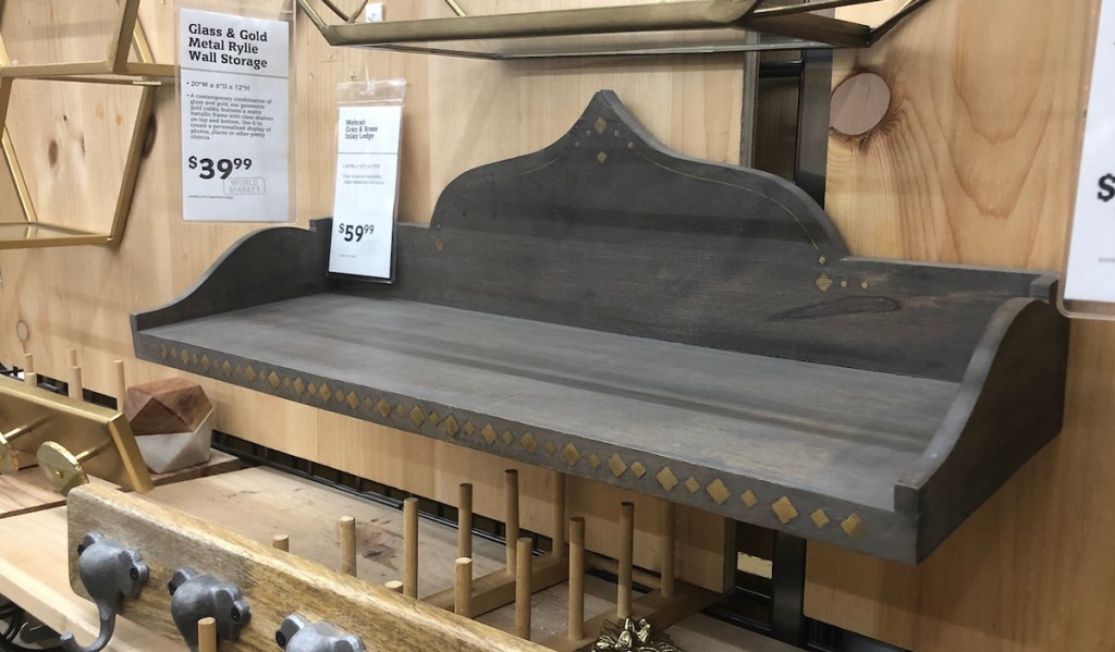 hand carved gray wood shelf in the shelving aisle at store