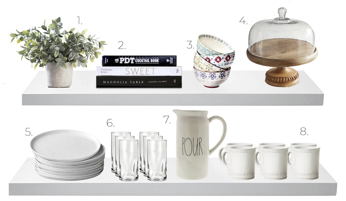 kitchen shelves with dishes, plants, books, bowls, plates, glasses, water pitcher, coffee mugs