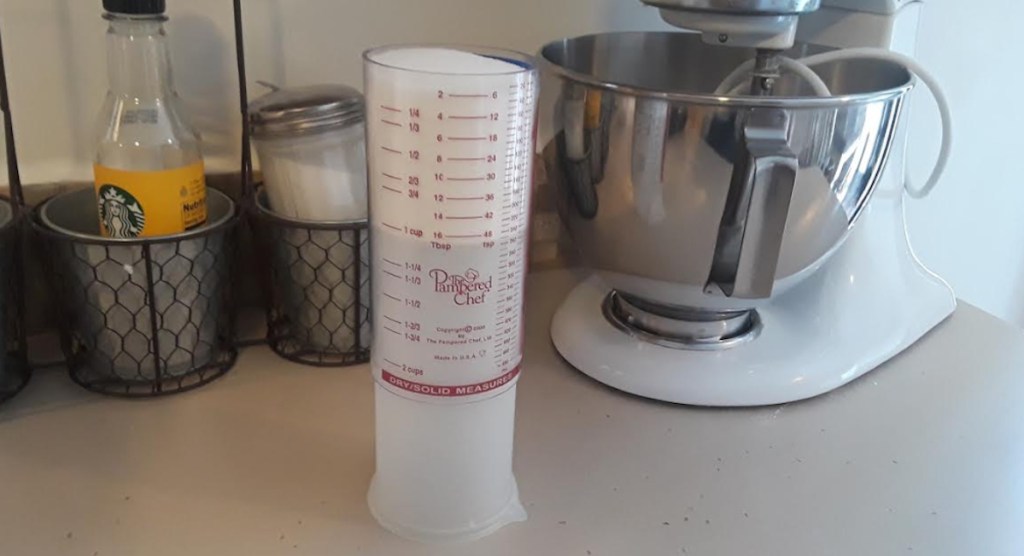 pampered chef measuring cup sitting on a kitchen counter