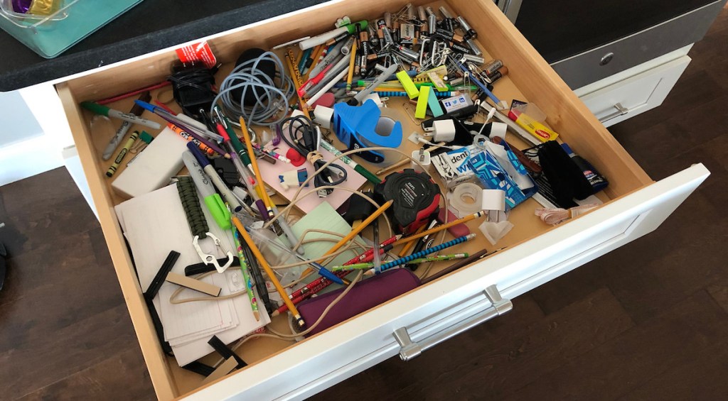 unorganized messy junk drawer