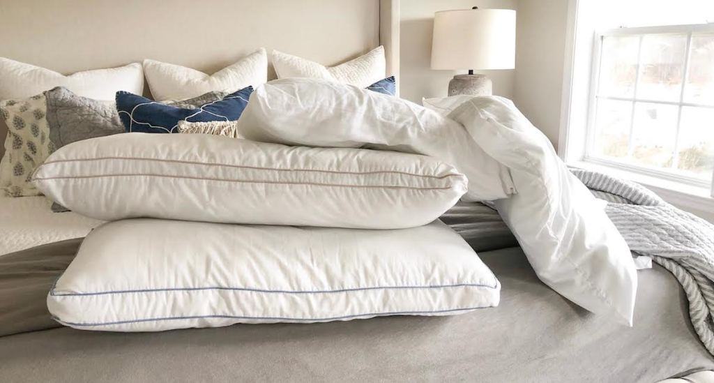 sleeping pillows without cover on bed