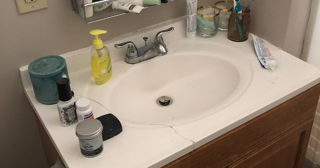 messy and cracked countertop sink