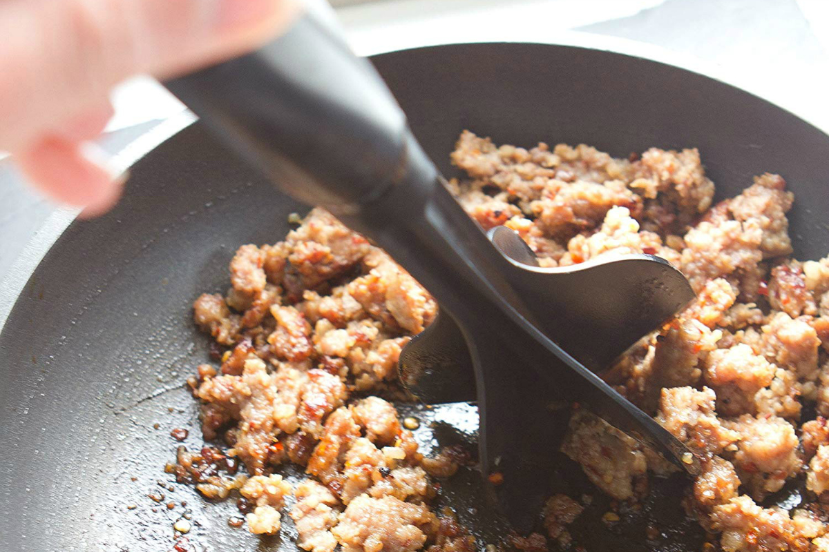 meat chopper in pan with ground beef