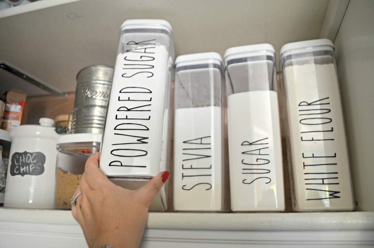 labeled kitchen canisters in the pantry 
