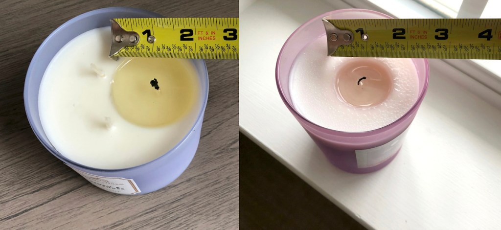 ruler measuring melted wax on two purple candles
