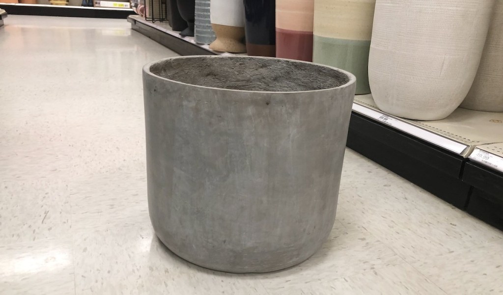 large concrete planter sitting on floor