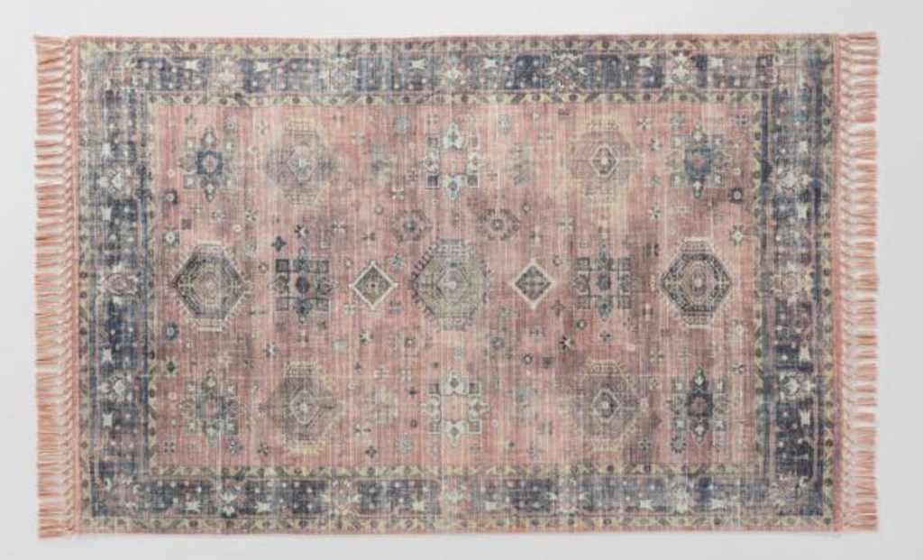 pink and gray colored persian style rug with gray background