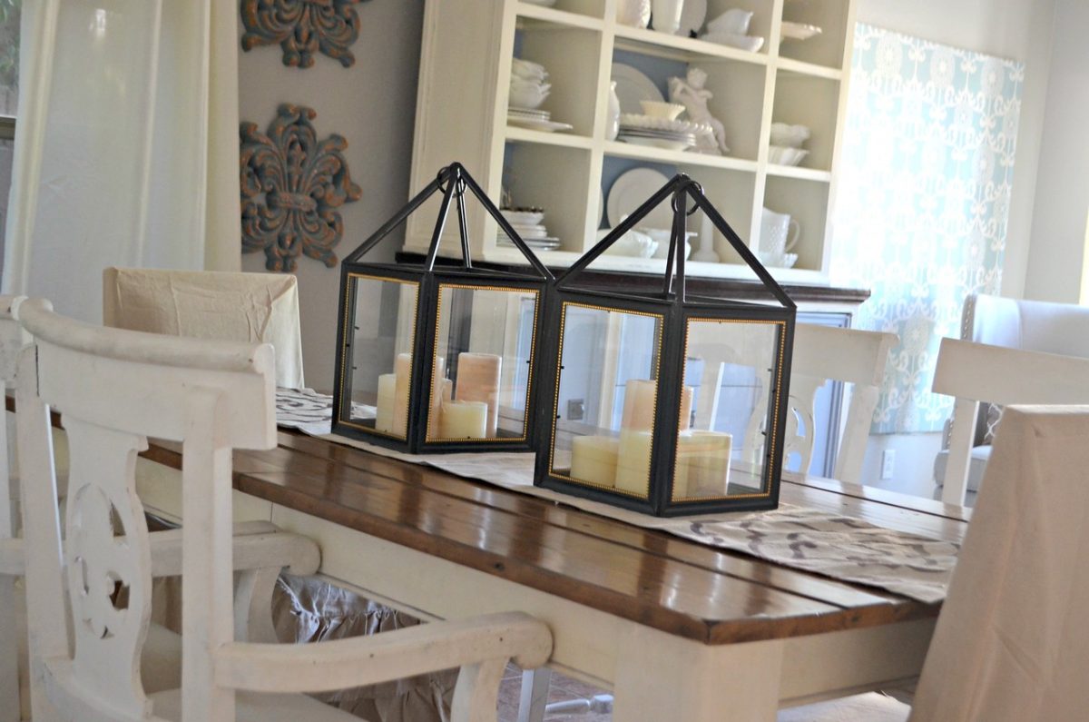 homemade decorative lanterns from dollar tree frames on a wooden table