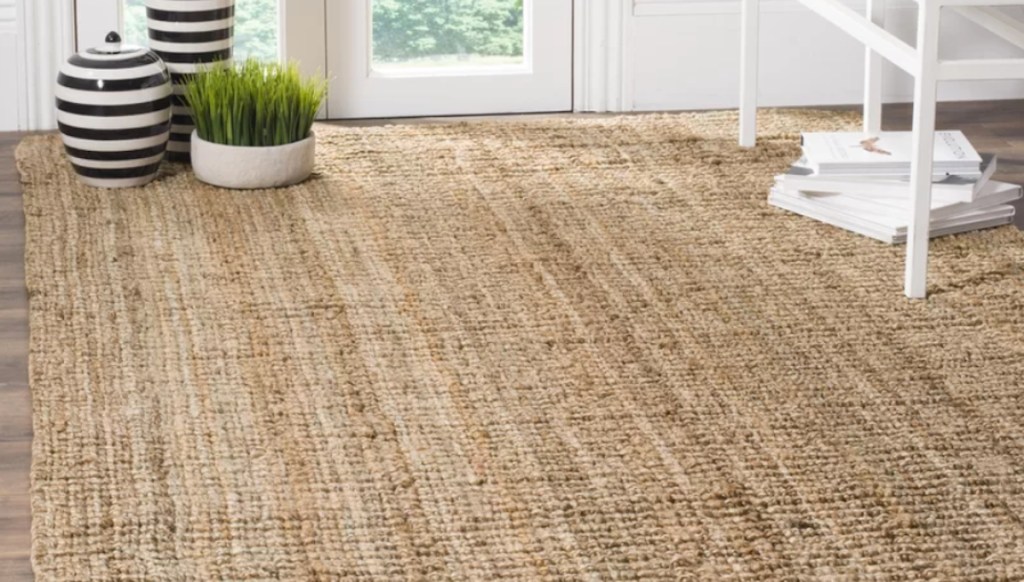 natural colored jute rug on floor with ceramic plant on top