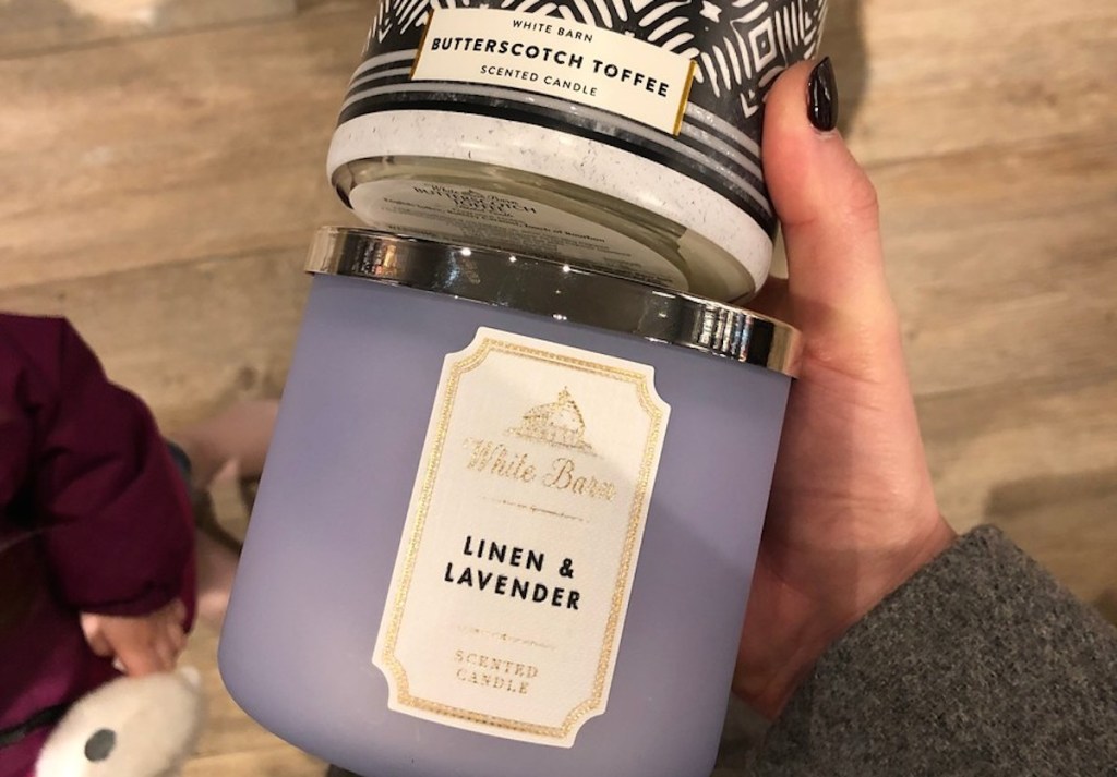 linen and lavender candle in hand