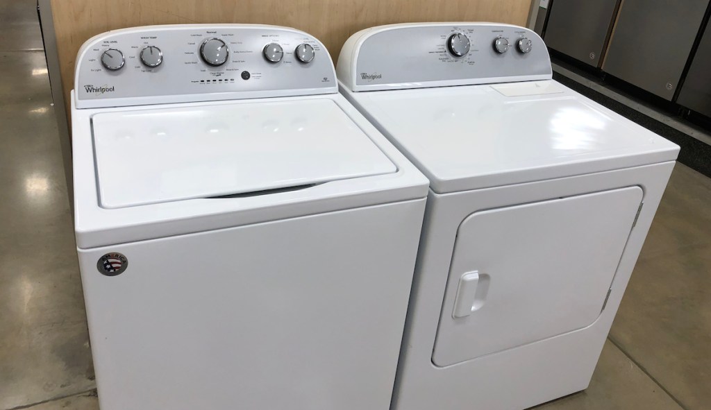 white top loading washing machine and matching white dryer appliances