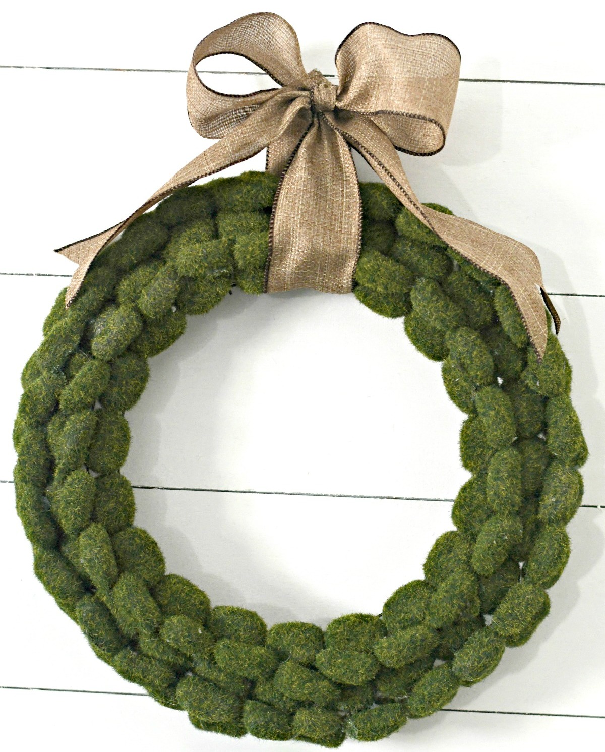 finished and hung up dollar tree moss rock wreath