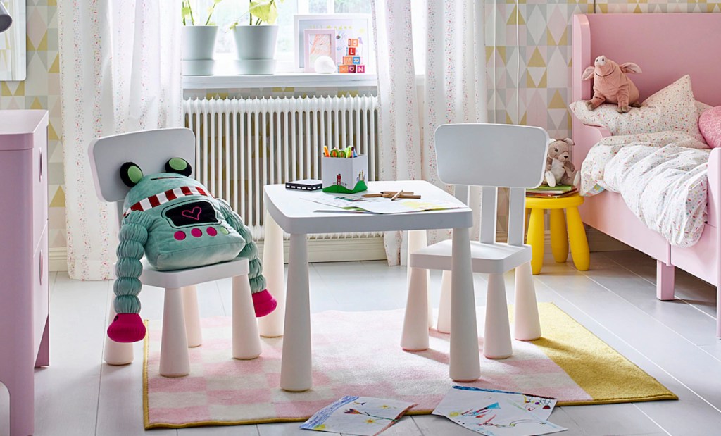 white children's table with matching chairs pink rug bed and dresser