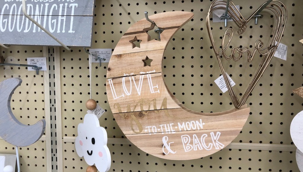 love you to the moon and back wooden moon shaped wall decor on shelf