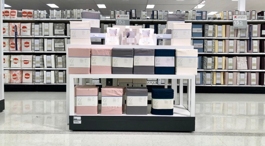 tons of different colored bedding lined up on store shelves
