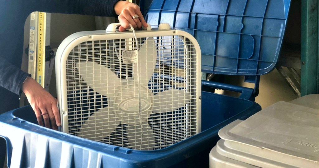 Bryn throwing box fan in trashcan