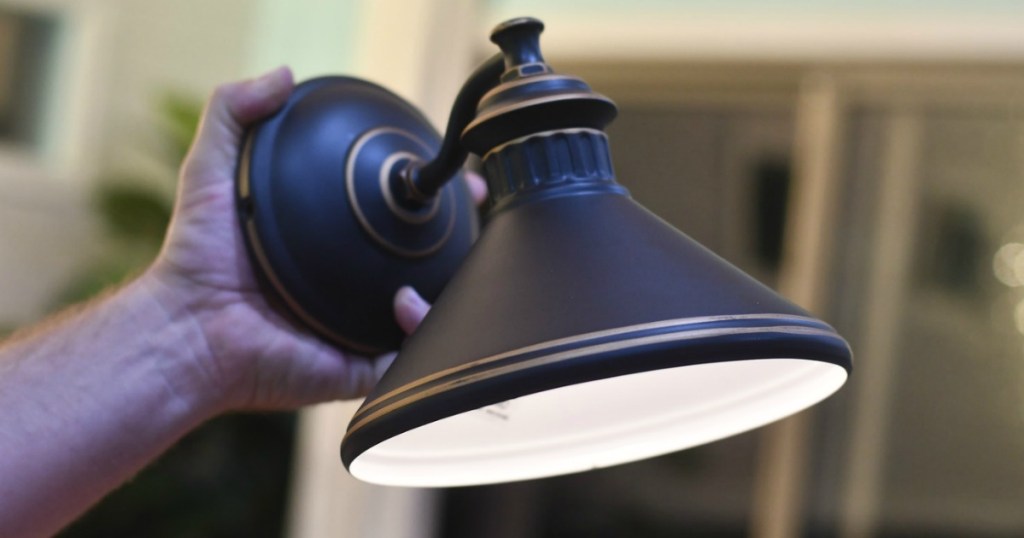 holing wall sconce with wireless battery-operated light puck