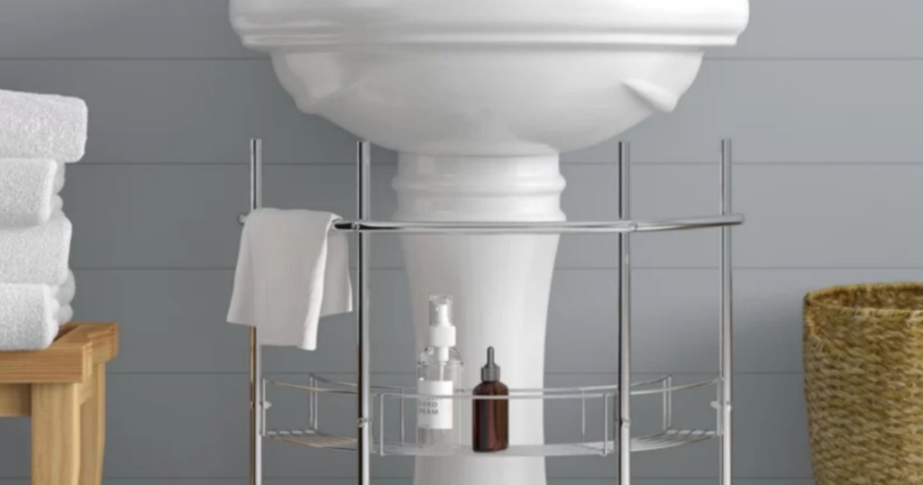 Undermount pedestal sink storage piece 