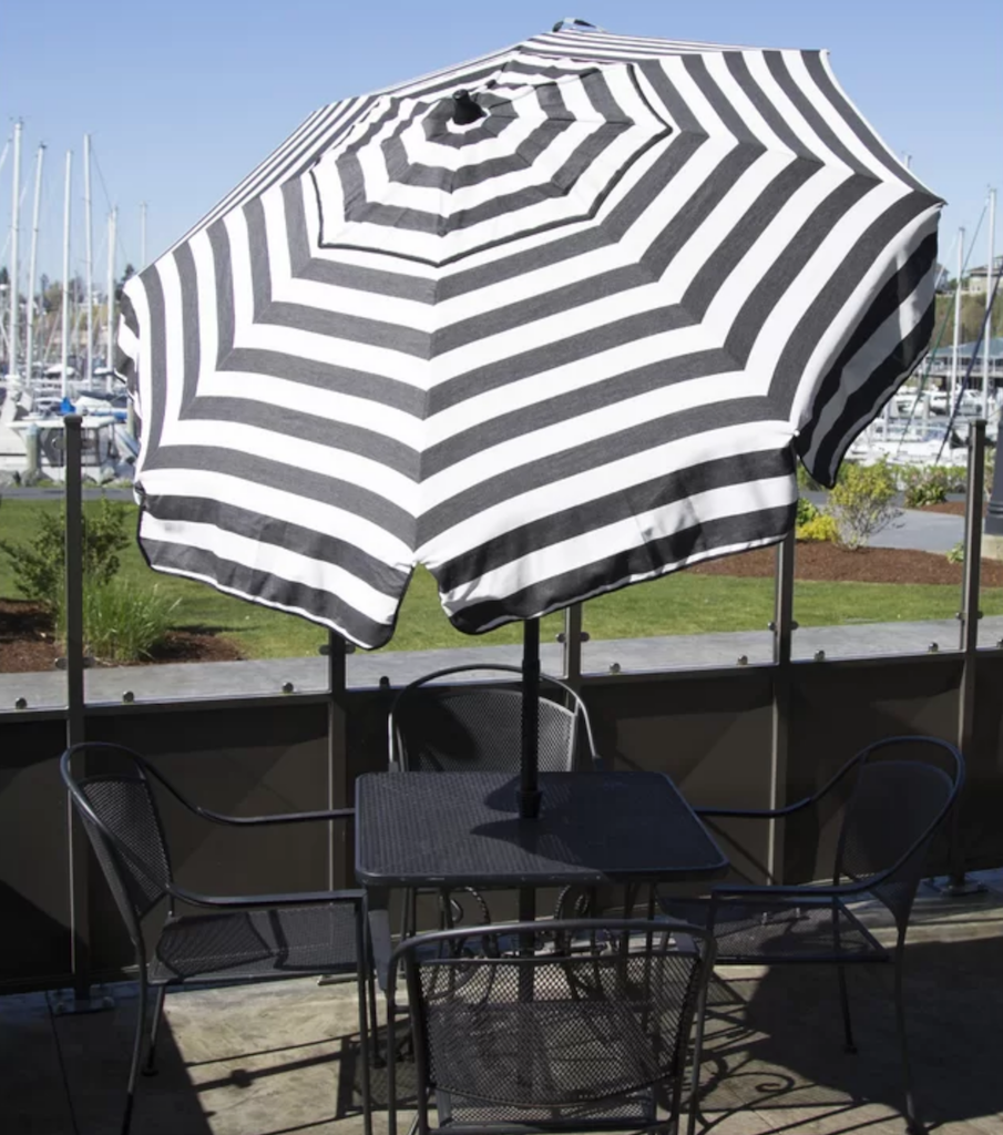 black and white striped umbrella on patio 