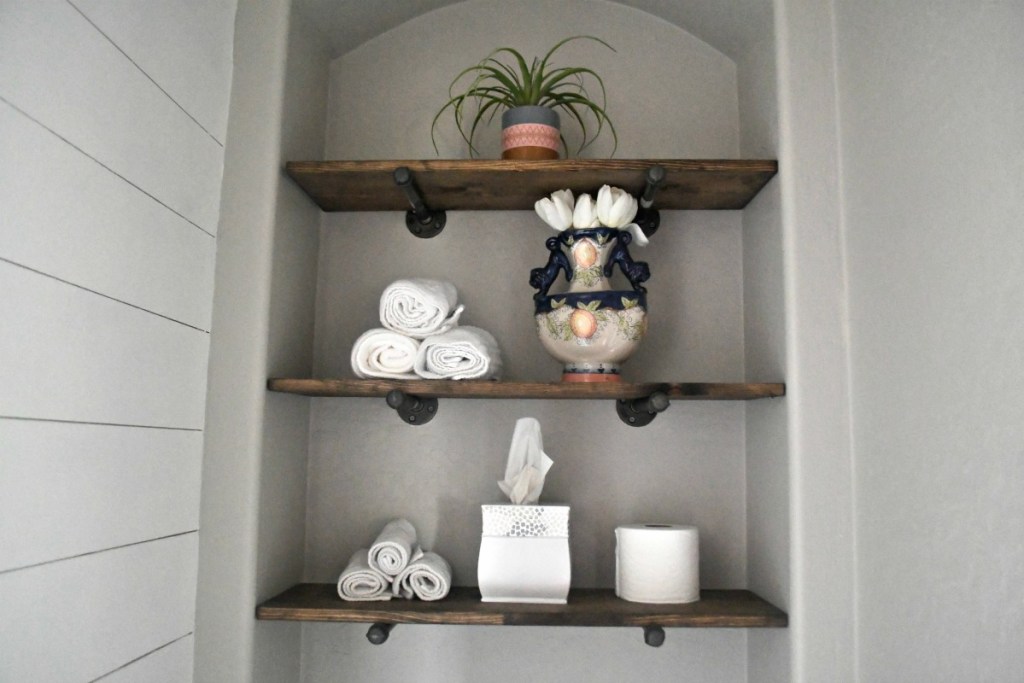 diy bathroom pipe shelving above the toilet for storage