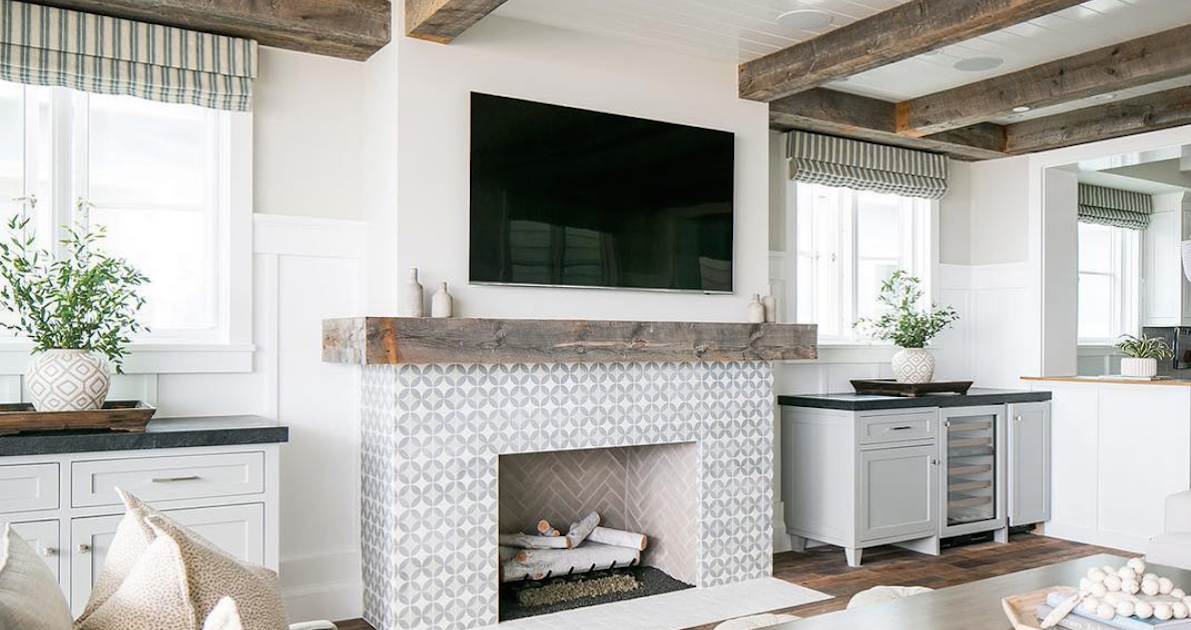 living room with tv over fireplace