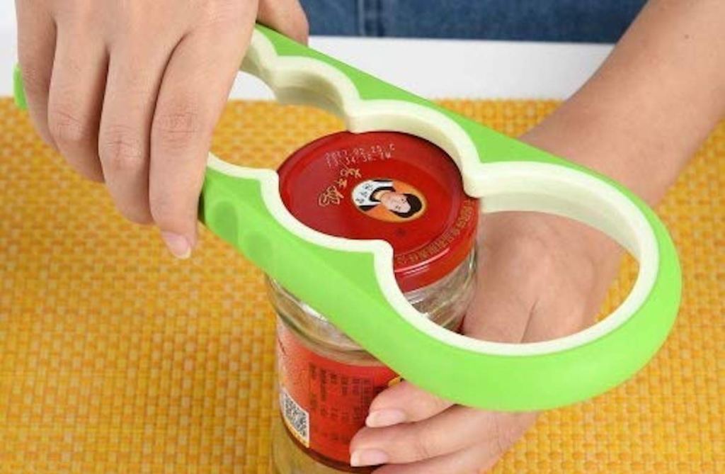 hands holding a jar using lime green jar opener 