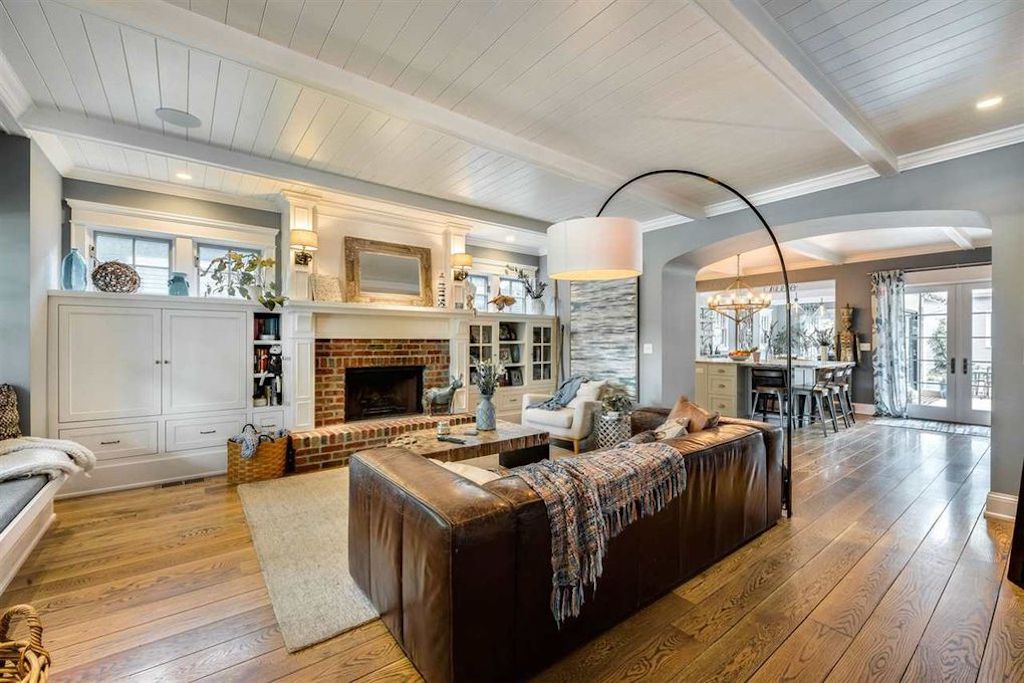 living room with brick fireplace 