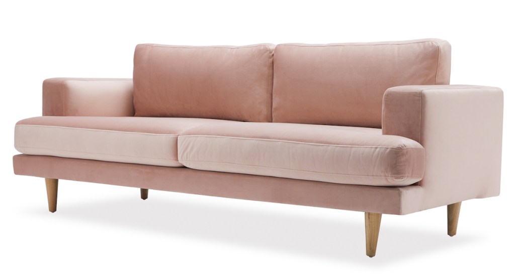 white stock photo of pink velvet art deco modern couch sofa