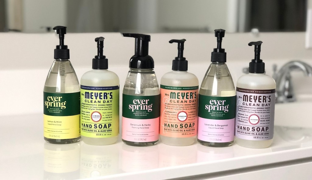 mrs meyers and everspring hand soaps lined up with various scents and colors 