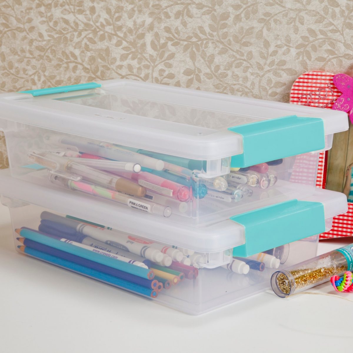 small clip storage boxes with school supplies 