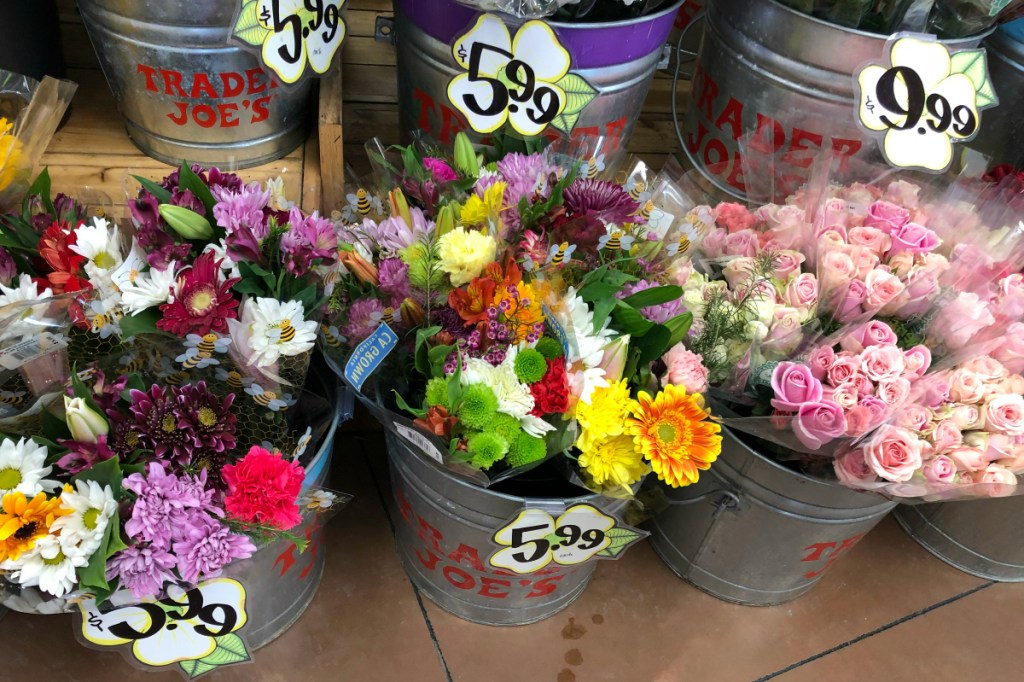 bouqets of flowers in silver pails