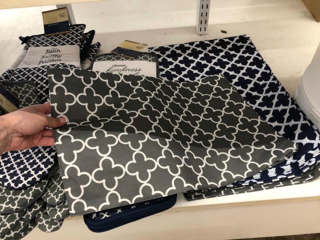gray trellis-patterned placemat on shelf at Dollar Tree