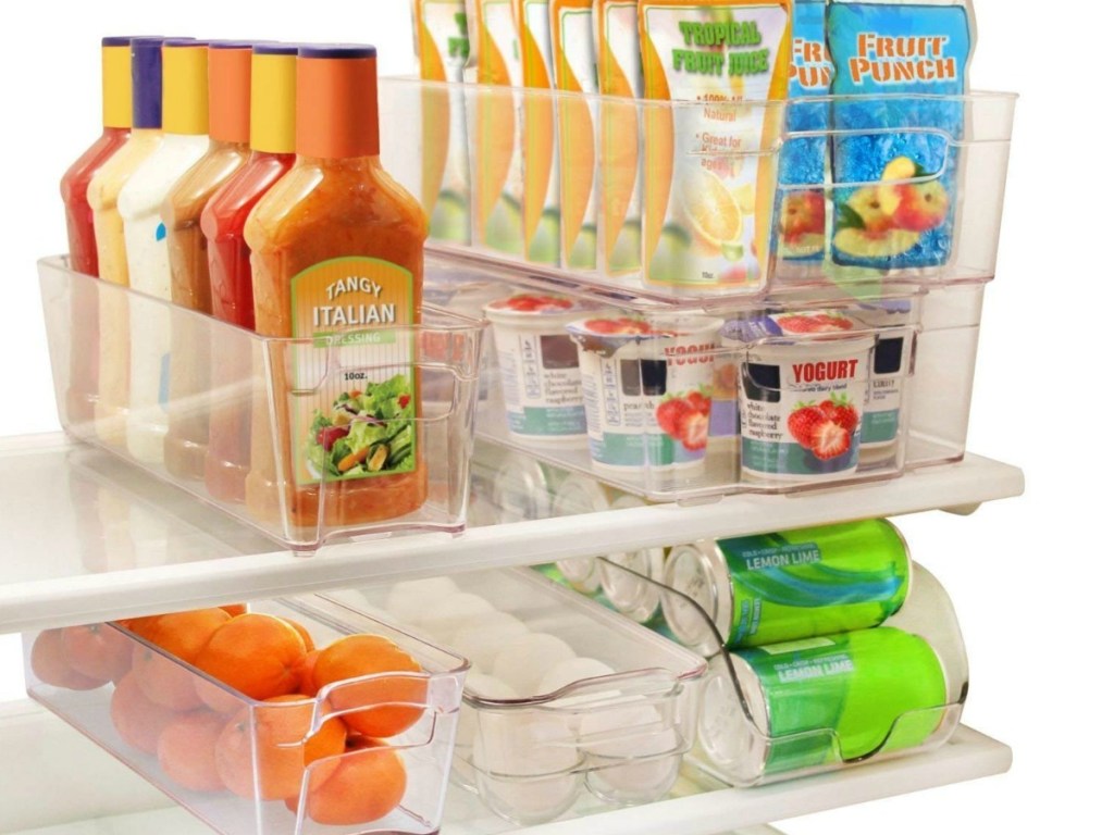 clear organizational trays holding salad dressing, fruit and more